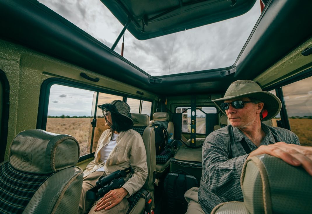 An image of a couple on a safari truck